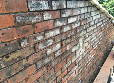 Before — stained brickwork, Hackney