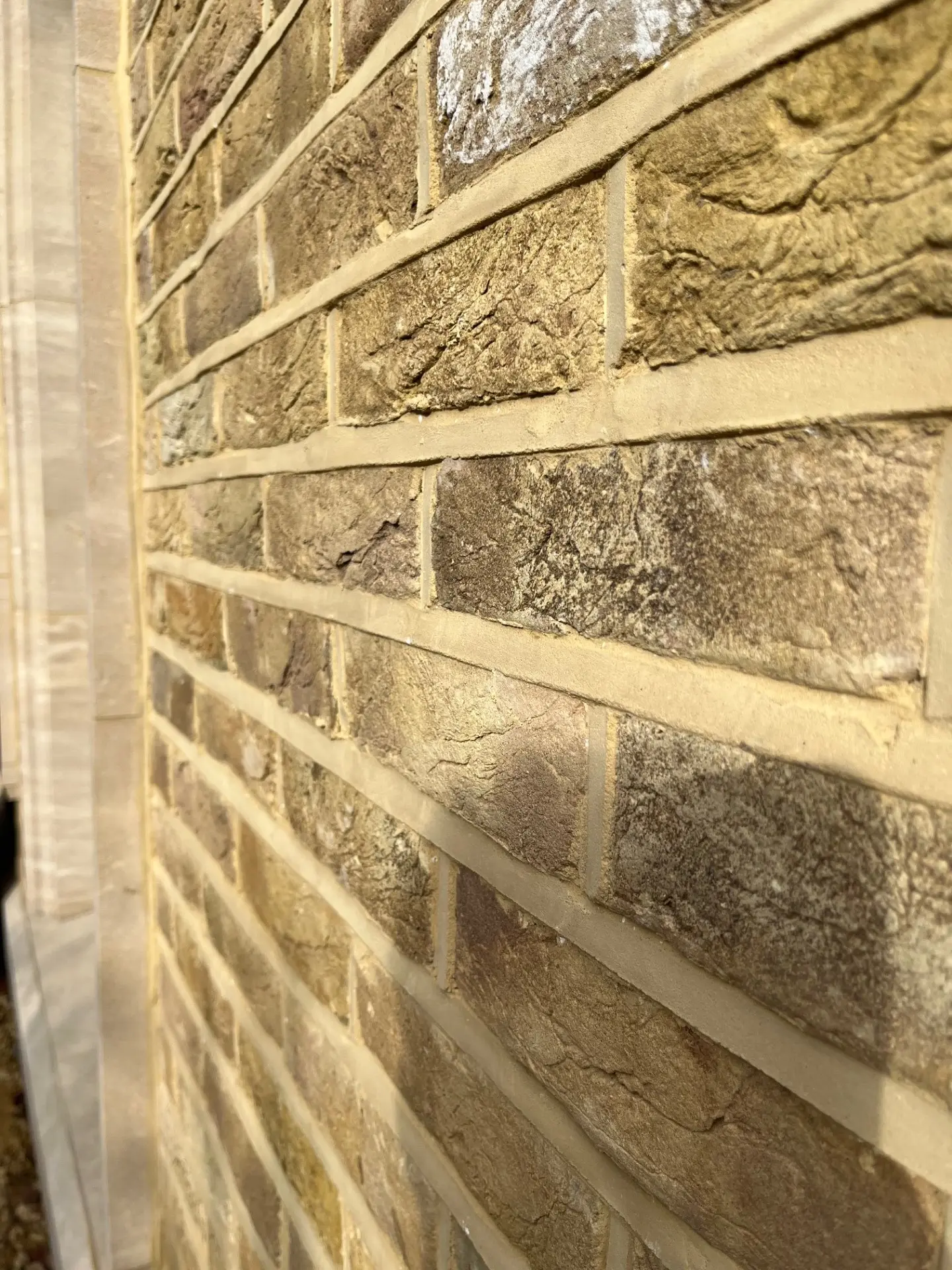 Close-up of lime mortar weather-struck repointing on a Victorian property in Croydon, South London