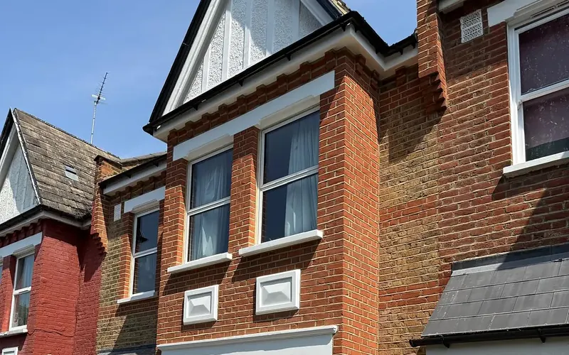 Restored London brick house after lime mortar repointing