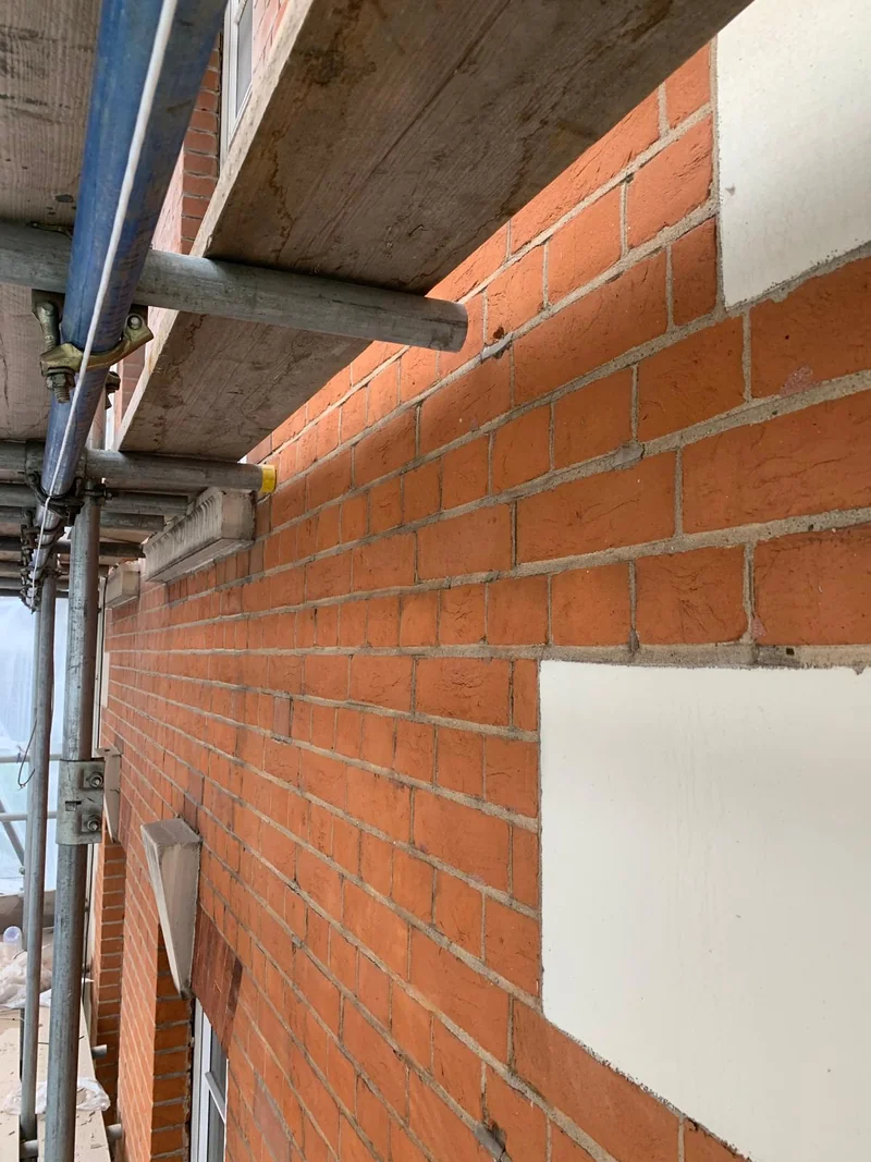 Before — deteriorated cement mortar joints, Mayfair