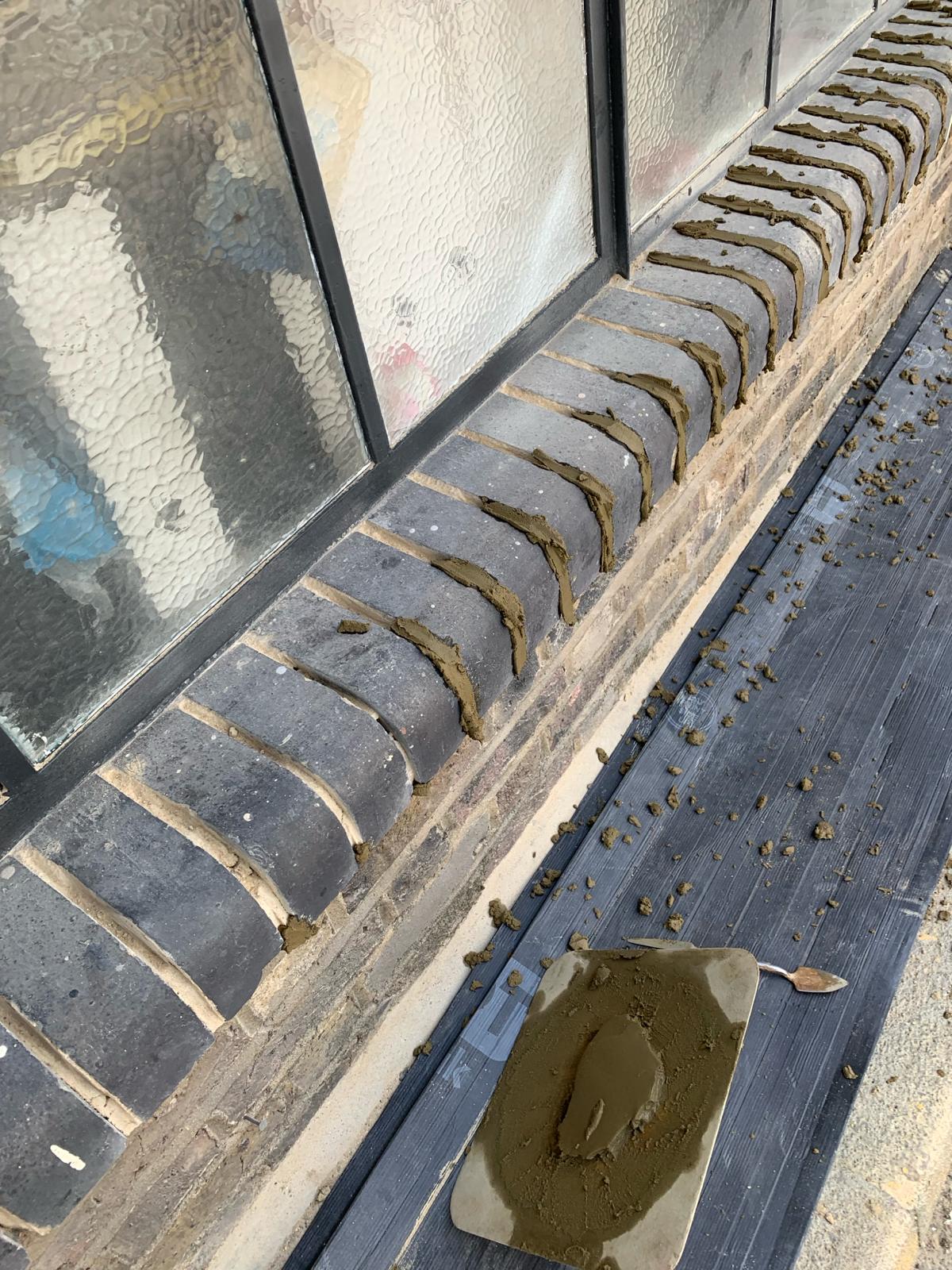 Victorian terrace brickwork before lime mortar repointing — eroded mortar joints, Tottenham North London