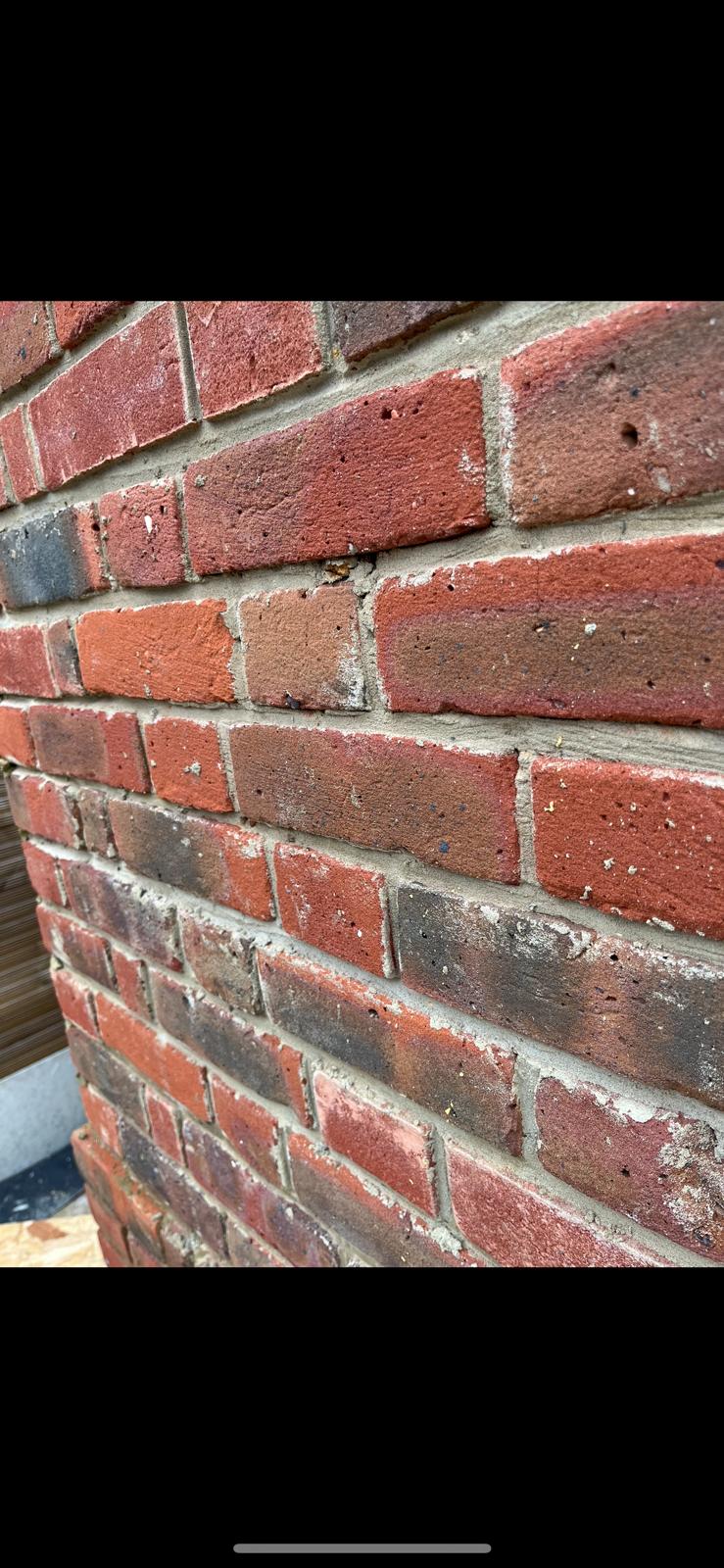 Victorian brickwork before weather-struck repointing — deteriorated mortar joints, Harringay North London